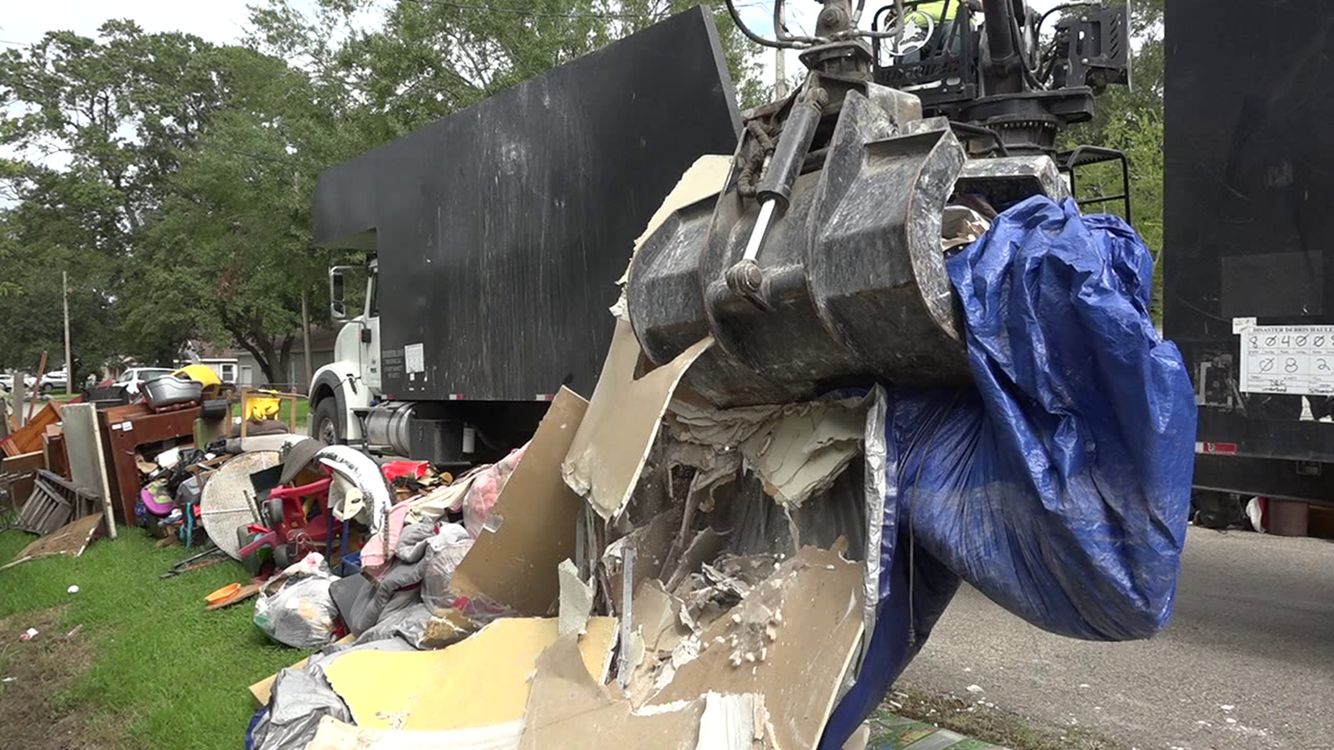 As debris piles up, so do questions about help. FEMA representatives have been going door-to-door talking to people about Imelda damage.