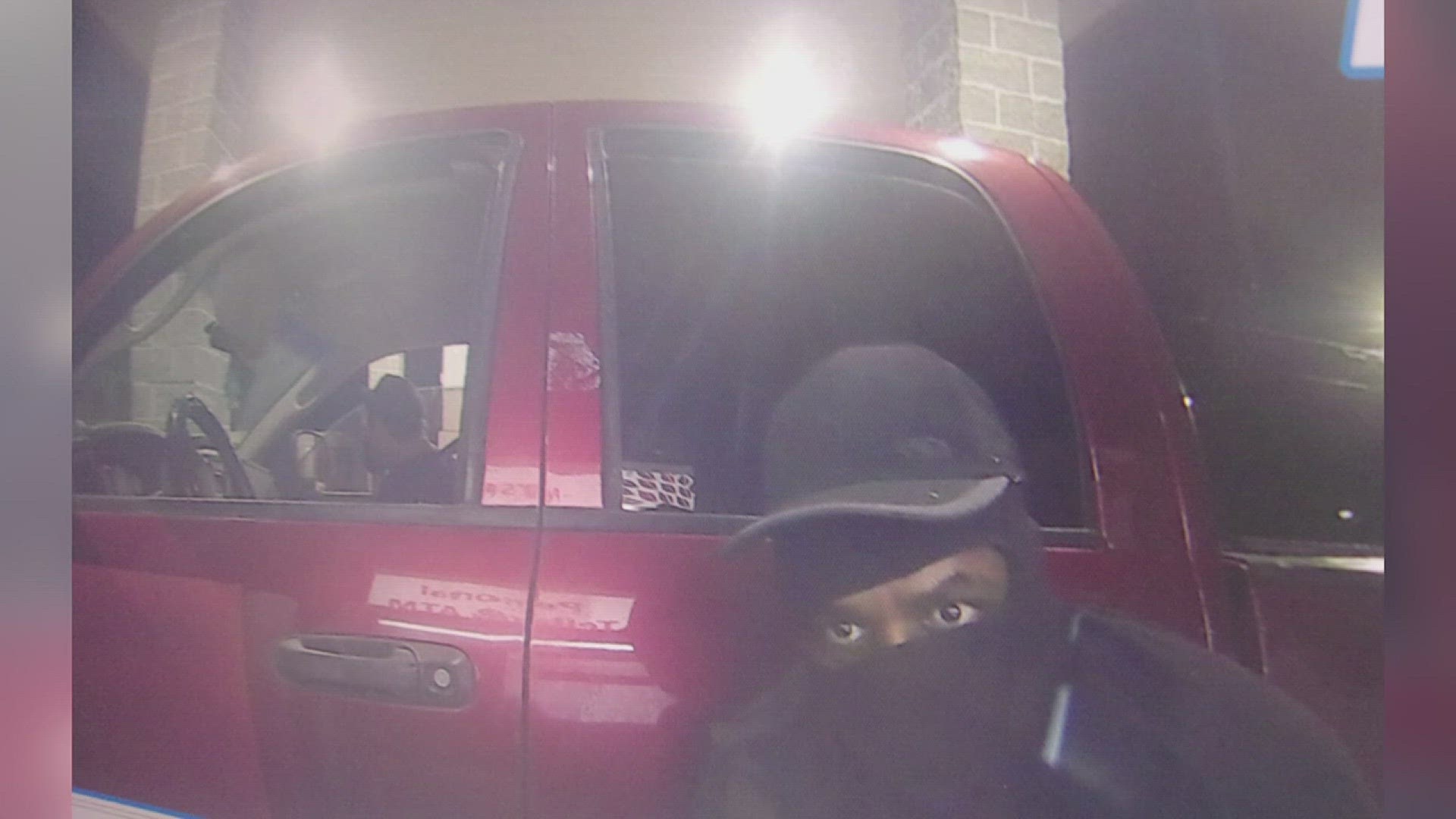 Camera surveillance shows a red Dodge Ram pickup drive up to the ATM at Mid-County Teachers Credit Union.