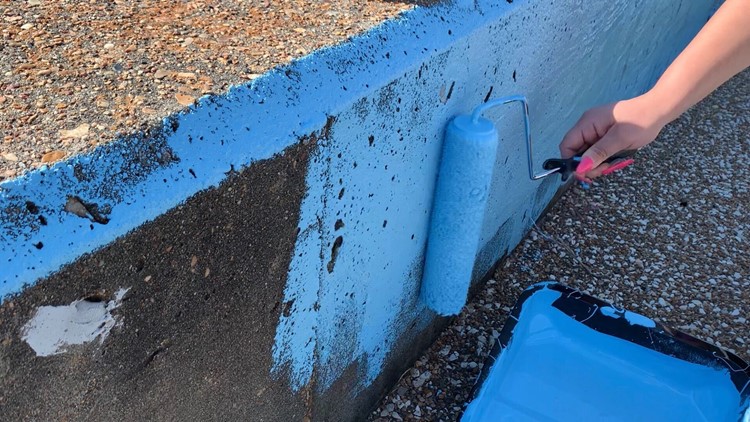 Port Arthur community teams up to paint over defaced seawall mural