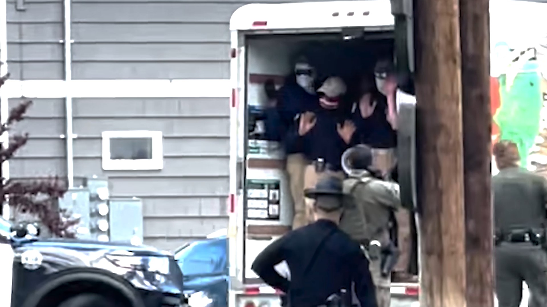 Police stopped a U-haul in Coeur d'Alene on Saturday and detained about 20 people inside who were all dressed the same