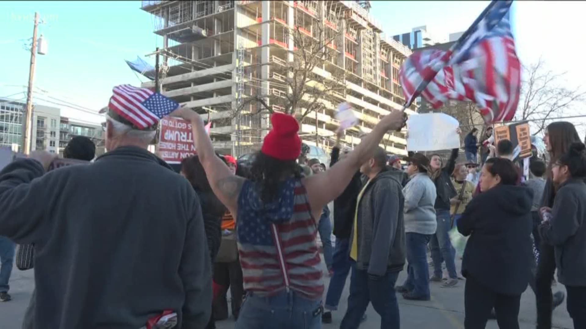 Protesters gathered in Austin on Sunday in response to President Donald Trump visiting Austin to give a speech at the American Farm Bureau Federation convention.