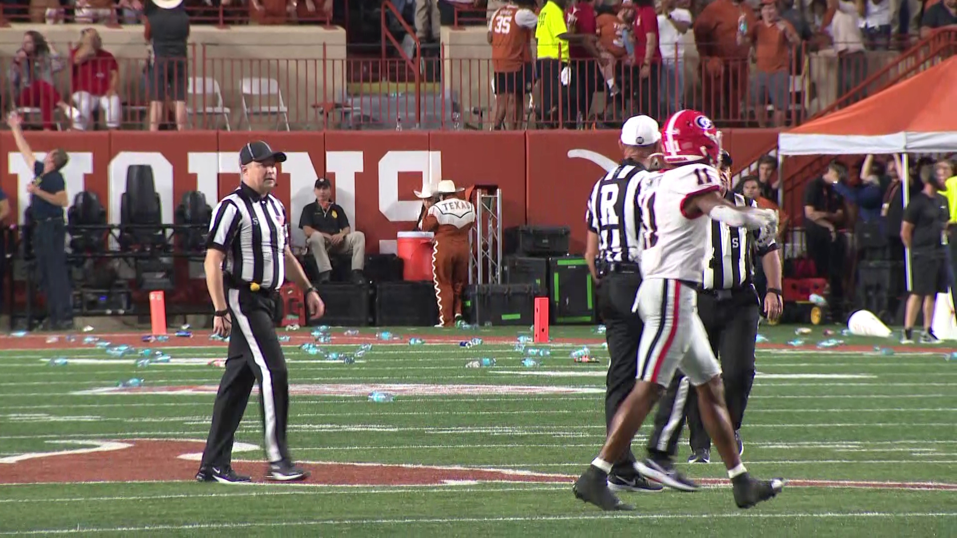 The game was paused briefly in the third quarter after fans threw trash onto the field following a controversial officiating call.