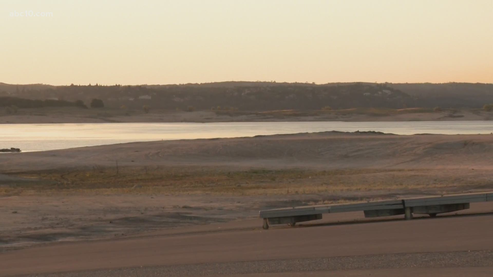 A look at Folsom Lake shows low water levels and a nearby boat ramp that does not even reach the water.