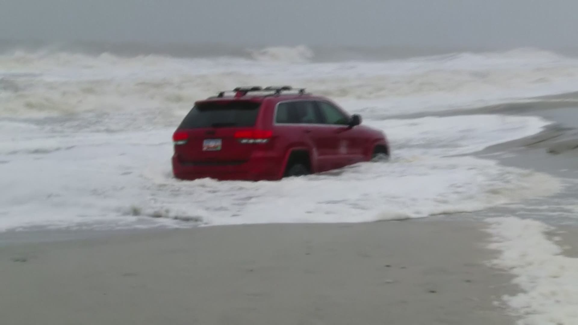 Police in Myrtle Beach said a driver got stuck on the beach at Myrtle Beach ahead of Hurricane Dorian in South Carolina. The SUV was then abandoned on the beach as high tide came ashore.