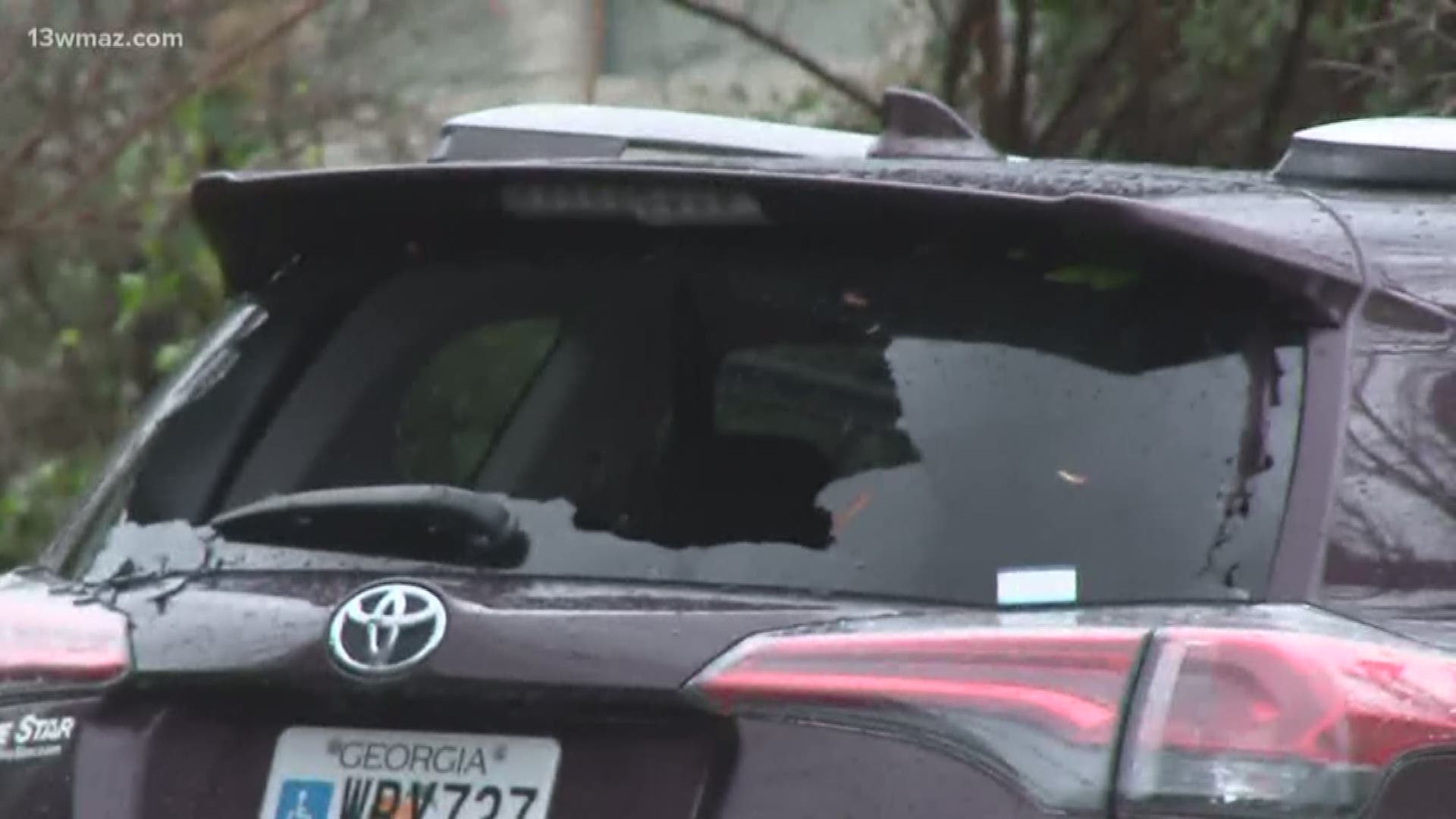 Some trees were toppled and cars were damaged on the corner of First Street and Orange Terrace in downtown Macon.