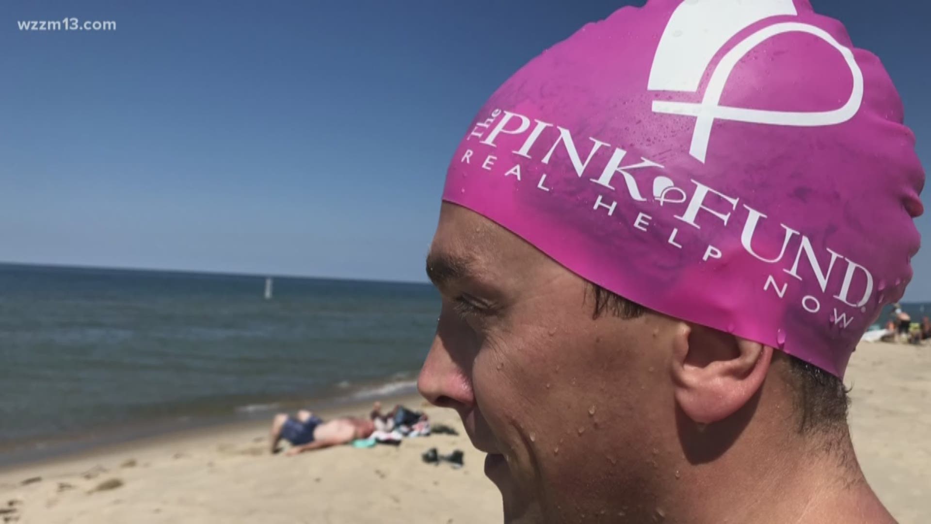 Man swimming for breast cancer awareness